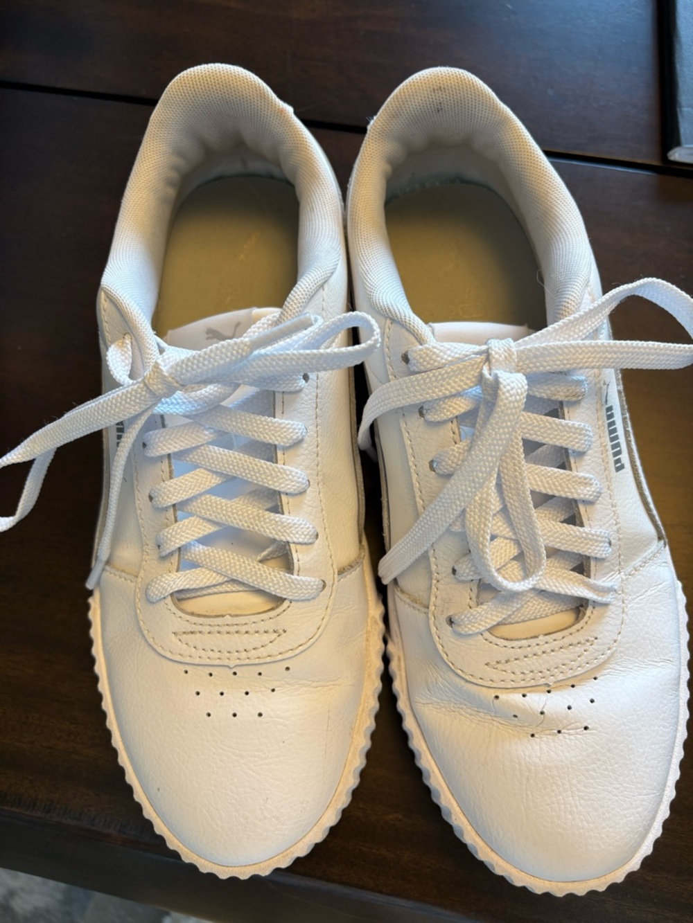 Puma Carina leather women’s sneakers with a rubber sole. 
Women’s size 9